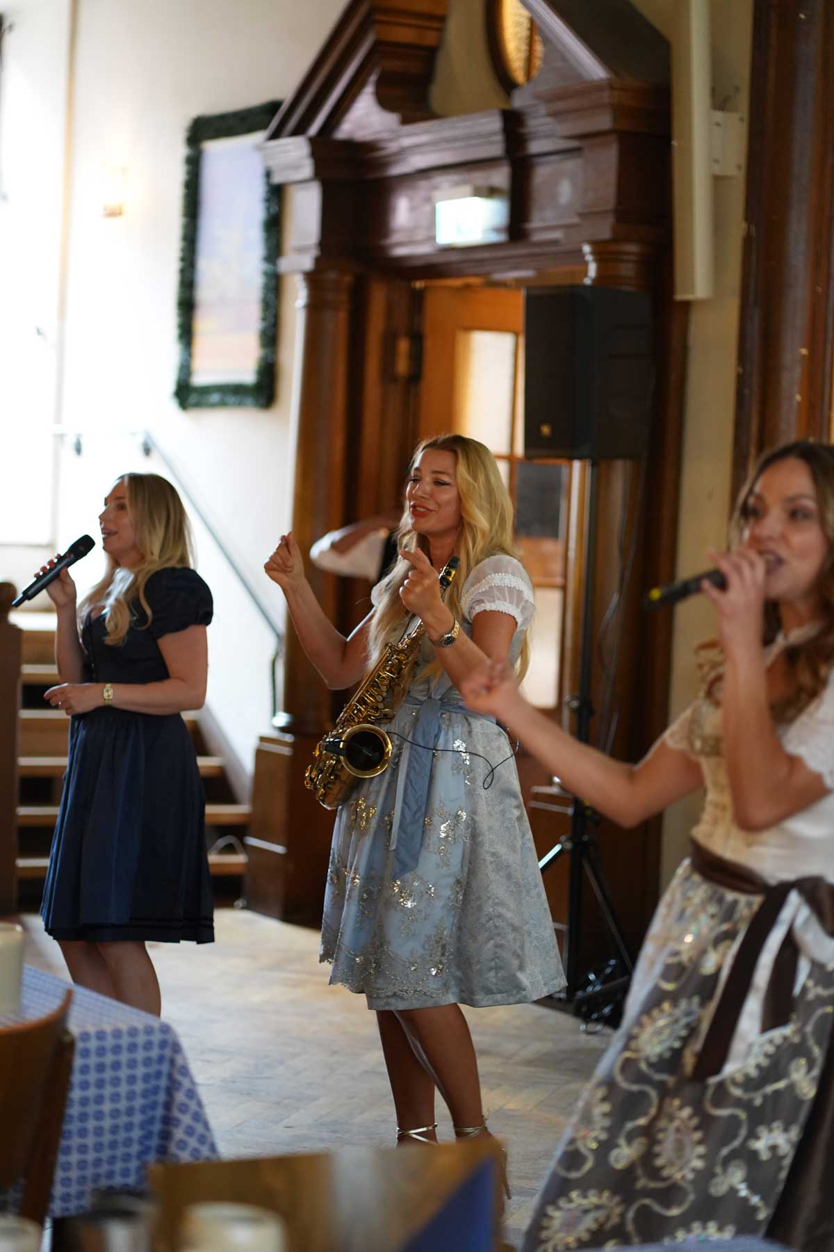 Oktoberfest show in Munich with two singers and saxophonist Natalie Marchenko