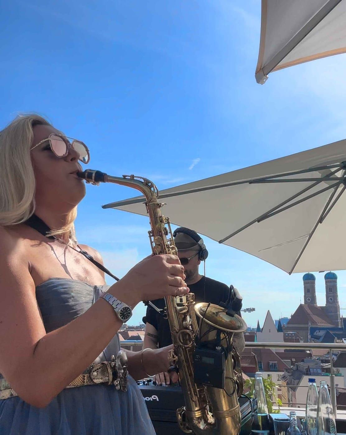 DJ and saxophonist rooftop event Mandarin Oriental Munich summer party