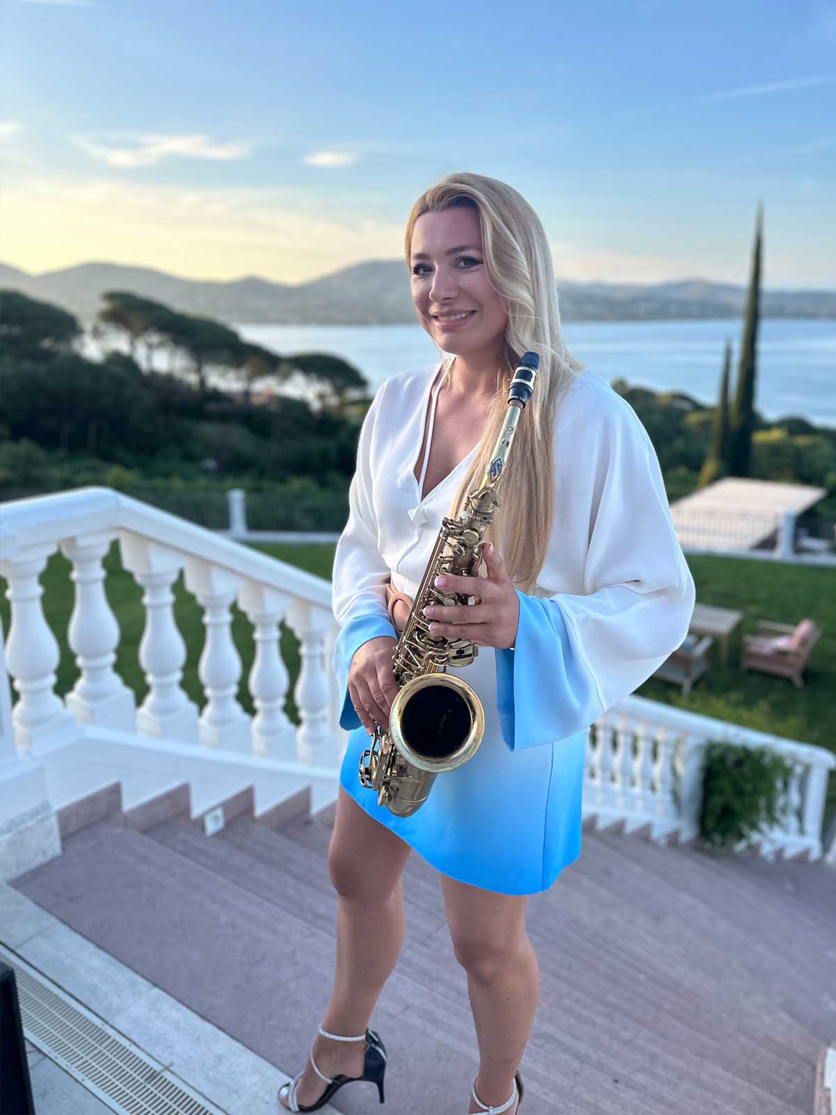 Saxophonist Natalie Marchenko in front of the Althoff Villa Belrose in Saint-Tropez at an exclusive networking event on the Côte d'Azur